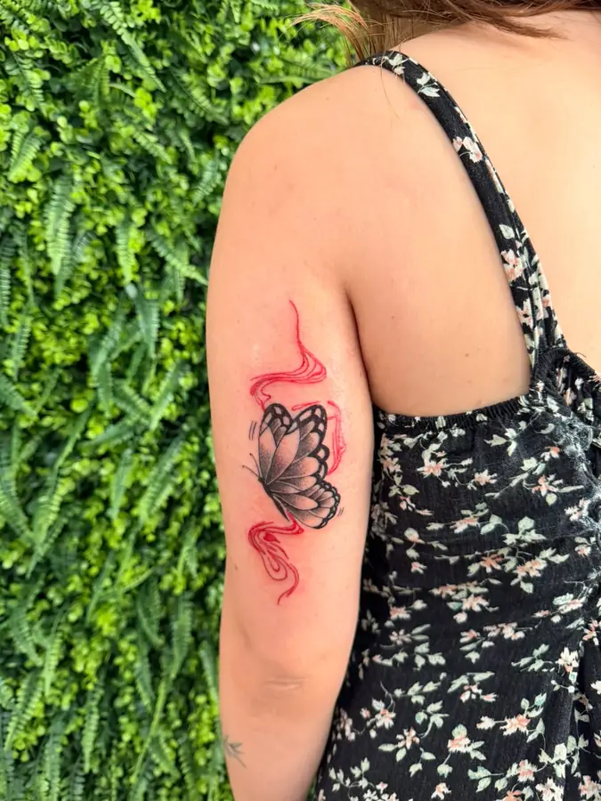 Tatuagem de borboleta feita por aluno do START
